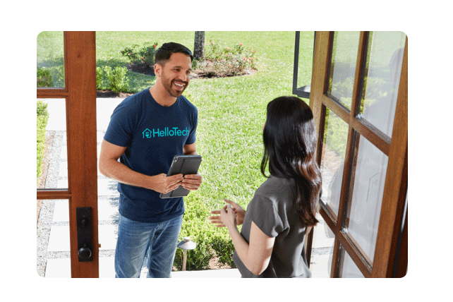HelloTech service tech talking to woman